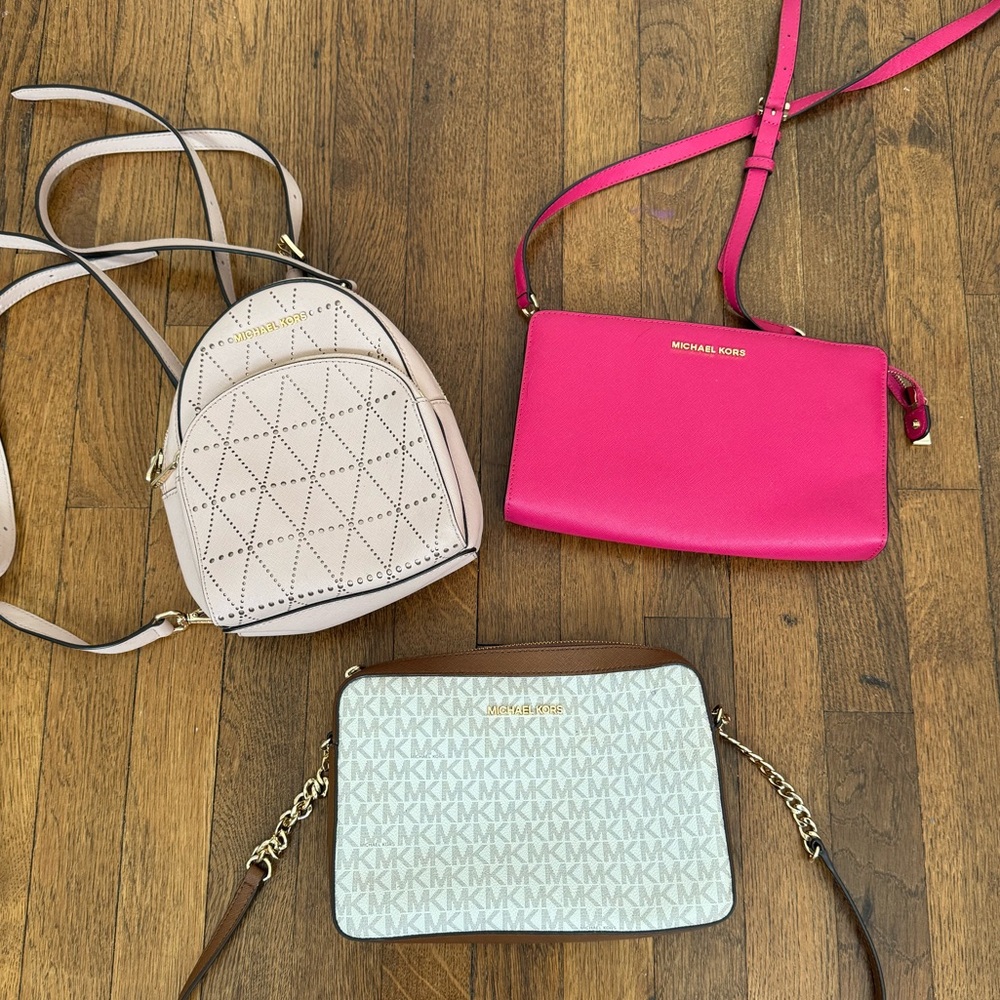 EACH SOLD SEPARATELY!! 2 Micheal Kors Cross Body Bags, and 1 Mini Backpack.